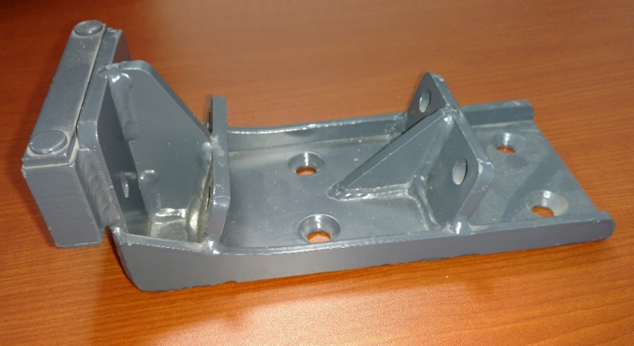 Trough Mounting Bracket shown as a mild carbon steel weldment, machined and painted.